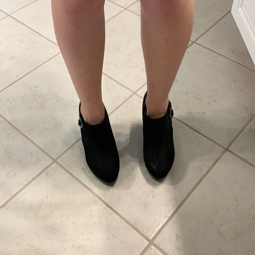 Black boot style high heels with a buckle size 7